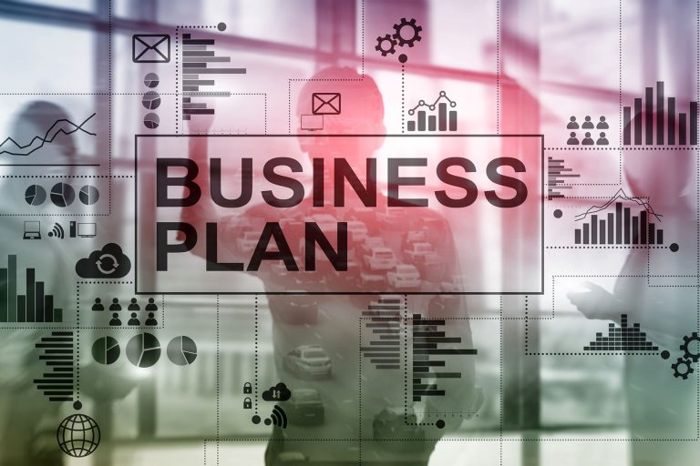 business-plan als schaubild mit diagrammen und business-mann im hintergrund