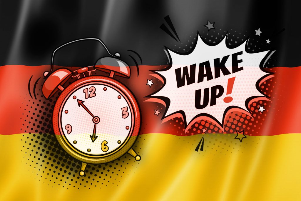 deutschland-flagge mit wecker und aufschrift wakeup